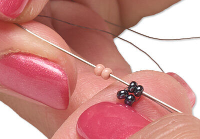 Beads threaded with a needle